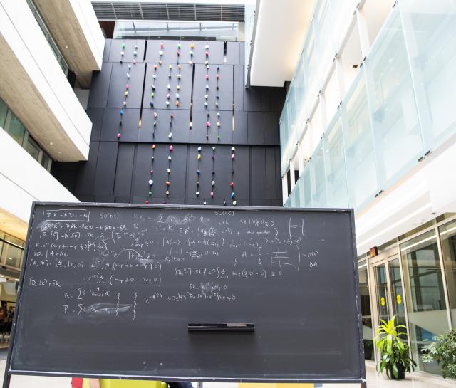 view of the atrium with a blackboard covered in equations