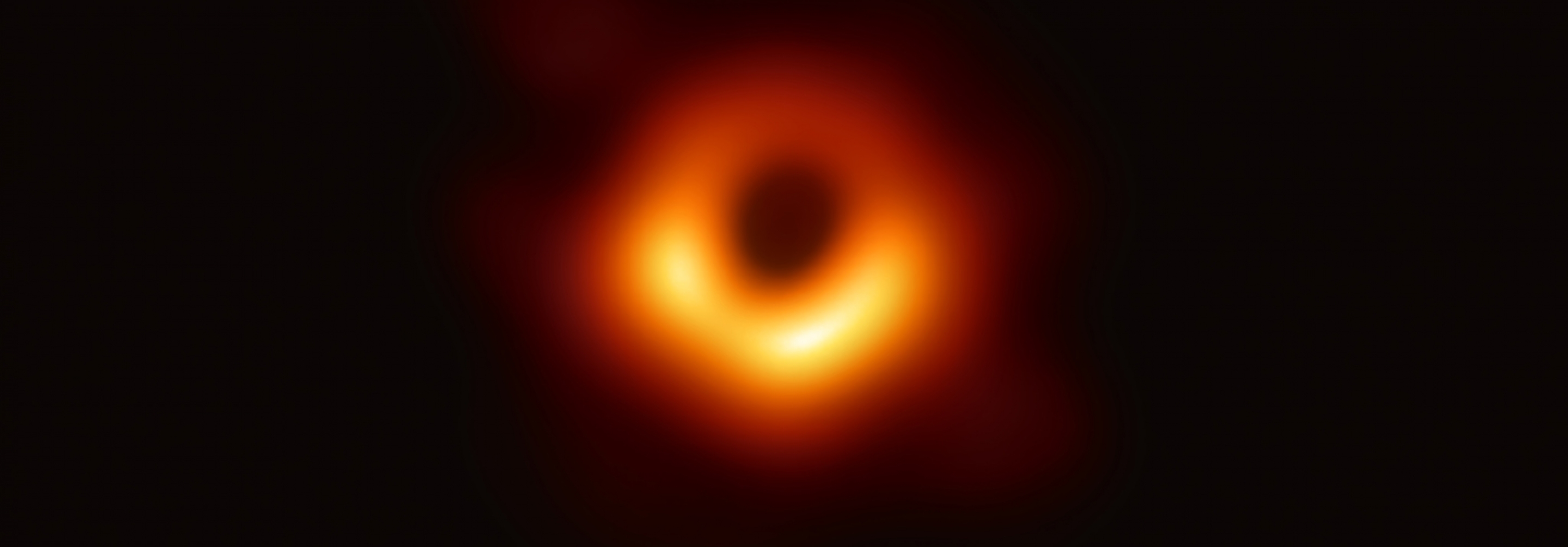 Scientific image of black hole on black background