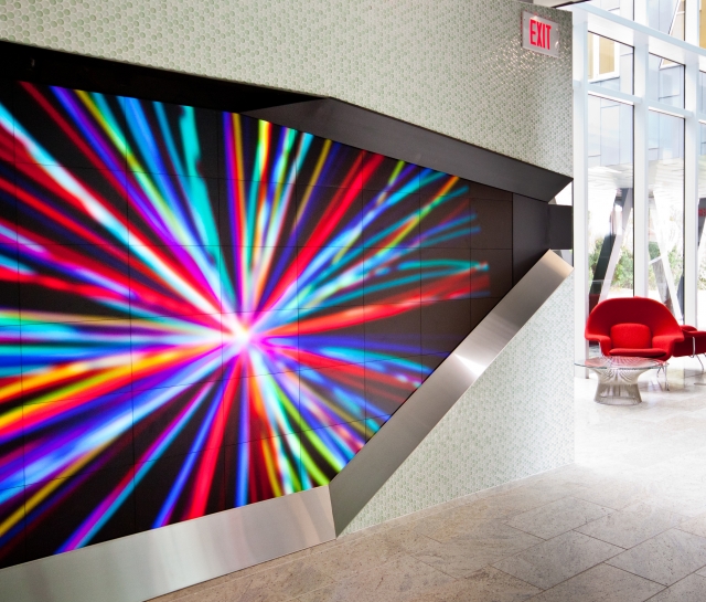 Colourful digital display in front entrance of building